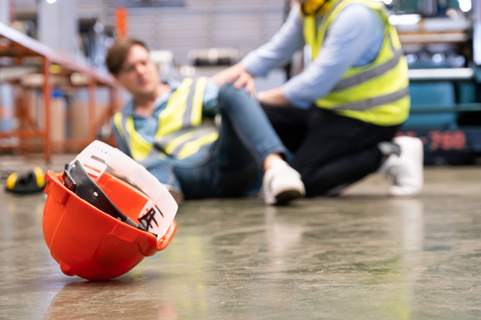 Industrial worker injured in slip and fall accident - workplace safety hazard