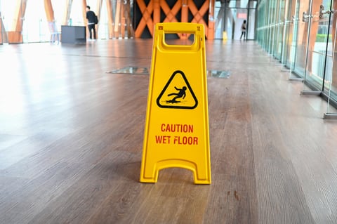 Walkway with slippery floor warning signs - pool area hazard